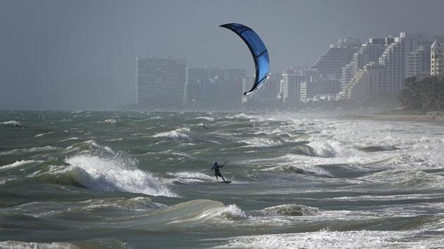 A kite surfer enjoys the wind in Lauderdale, Florida on August 24. State emergencies have been declared in Louisiana and Mississippi, and shelters are being opened to house evacuees. Workers on offshore oil rigs are being evacuated from production platforms in the Gulf of Mexico in anticipation of Laura’s arrival, reducing offshore oil and gas production to less than one-fifth the normal activity. (AP)