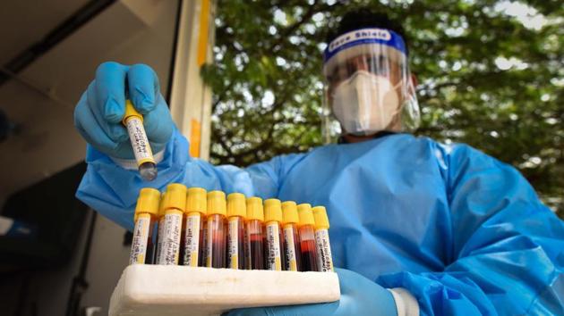 A medical personnel with vials of blood samples taken during a serological survey earlier in August. (Sanchit Khanna/HT PHOTO) A medical personnel with vials of blood samples taken during a serological survey earlier in August. (Sanchit Khanna/HT PHOTO)