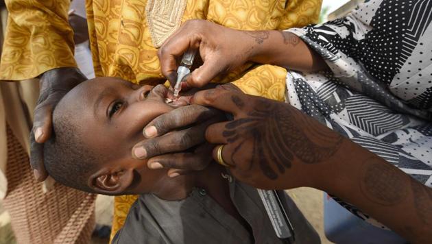 In this file photo taken on April 22, 2017 A Health worker administers a vaccine to a child during a vaccination campaign against polio.(AFP photo) In this file photo taken on April 22, 2017 A Health worker administers a vaccine to a child during a vaccination campaign against polio.(AFP photo)