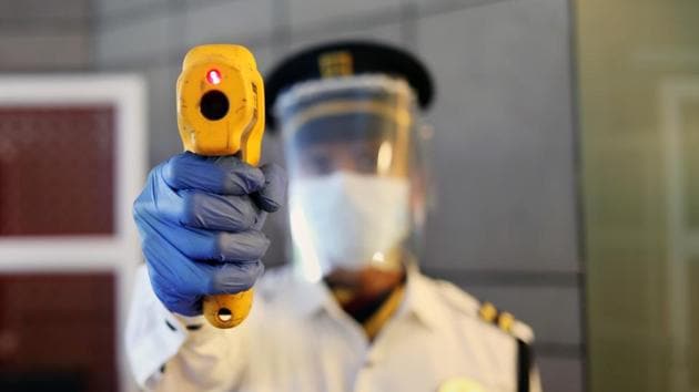 A security guard demonstrates the use of thermal screening equipment at the ITC Maurya Sheraton Hotel ahead of its reopening in New Delhi, India. (Bloomberg) A security guard demonstrates the use of thermal screening equipment at the ITC Maurya Sheraton Hotel ahead of its reopening in New Delhi, India. (Bloomberg)