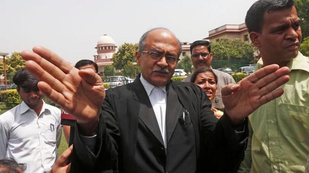 Prashant Bhushan, a senior lawyer representing the petitioner, speaks with the media outside the Supreme Court in New Delhi.(REUTERS)