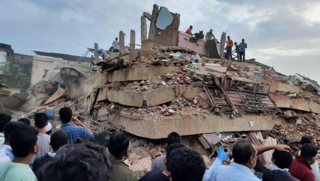 A gathering of people seen at the site where a decade old five-storey building collapsed in Mahad town of Raigad district in Maharashtra on August 24. (HT Photo) A gathering of people seen at the site where a decade old five-storey building collapsed in Mahad town of Raigad district in Maharashtra on August 24. (HT Photo)