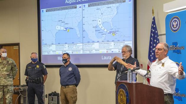 Louisiana Governor John Bel Edwards(R), answers questions while holding a media briefing about the state's activity related to storms Marco and Laura, on August 24, in Baton Rouge. Marco’s weakening winds have at least spared the Gulf what would have been twin hurricanes, unprecedented since records began 150 years ago. (Bill Feig./The Advocate via AP)