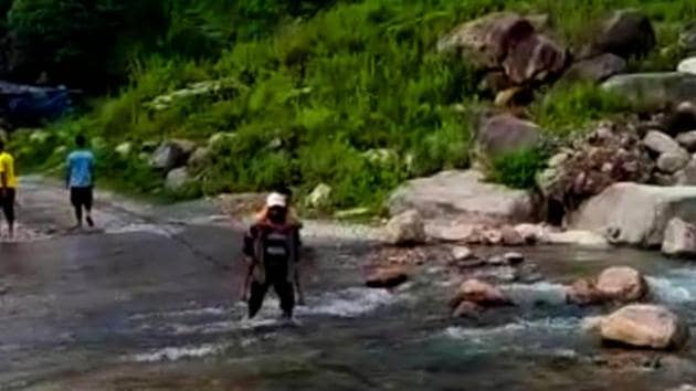 ‘Yamraj’ claims that in the past 36 years, he has helped over 18,000 people to cross flooded rivulets in Pithoragarh district. (HT Photo)