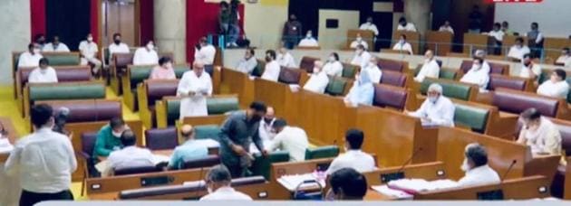 Leader of the opposition Bhupinder Singh Hooda and state home minister Anil Vij read out the obituary references soon after the Haryana assembly session got underway on Wednesday afternoon. MLAs were seen observing social distancing during the one-day session.(HT Photo)