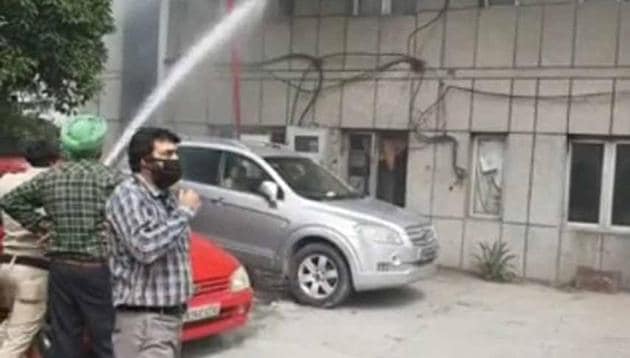 Fire officials dousing the flames at fire brigade office in Ludhiana on Wednesday (Gurpreet Singh/HT) Fire officials dousing the flames at fire brigade office in Ludhiana on Wednesday (Gurpreet Singh/HT)