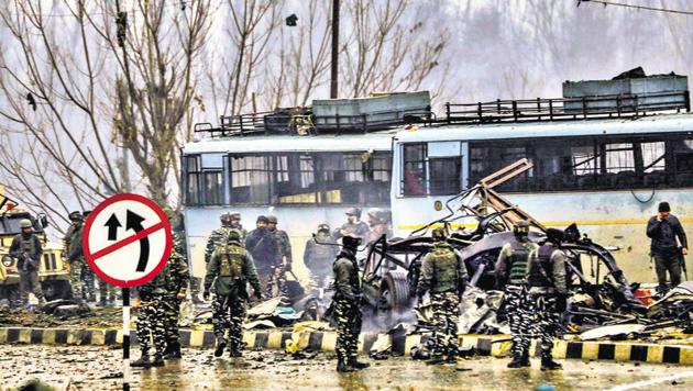 Security personnel carry out the rescue and relief works at the site of suicide bomb attack at Lathepora Awantipora in Pulwama district of south Kashmir.(PTI)