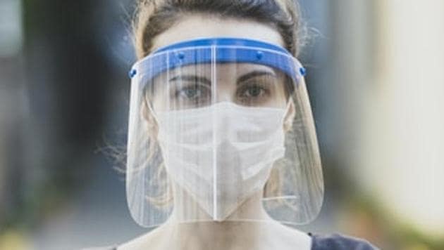 A woman wearing a face mask and a shield.(Unsplash) A woman wearing a face mask and a shield.(Unsplash)