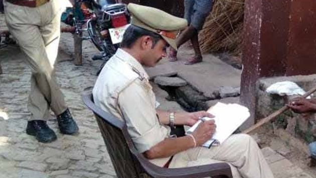 A police team recording the statement of the victims in Gursahaigunj village in Kannauj.(HT PHOTO) A police team recording the statement of the victims in Gursahaigunj village in Kannauj.(HT PHOTO)