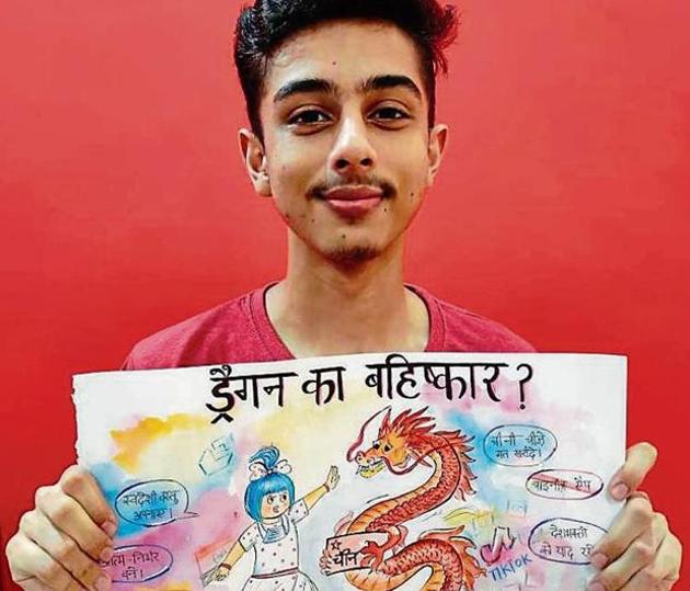 A student of BCM School, Chandigarh Road, showcasing his poster during a virtual language-based activity.(HT)