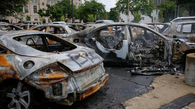 Cars burned in fires are seen following protests against the police shooting of Jacob Blake in Kenosha, Wisconsin, US.(VIA REUTERS) Cars burned in fires are seen following protests against the police shooting of Jacob Blake in Kenosha, Wisconsin, US.(VIA REUTERS)