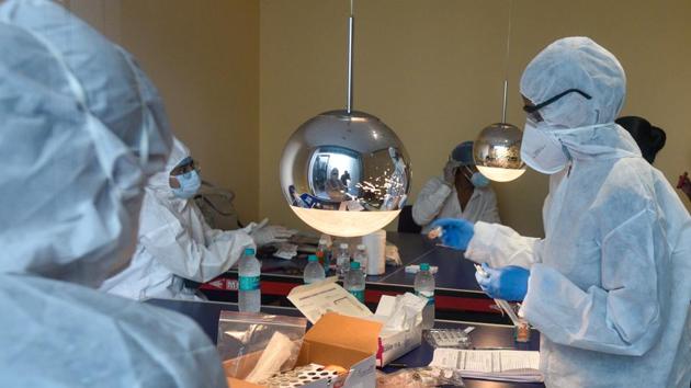 Healthcare workers during Covid-19 screening and swab testing.(HT PHOTO)