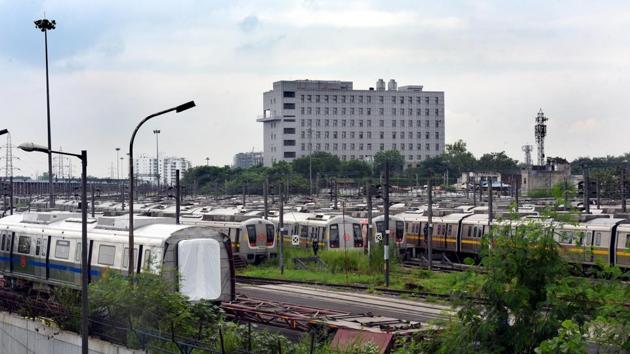 Delhi Metro Rail Corporation (DMRC) staff perform maintenance work on a train coach ahead of Unlock 4 in Delhi, at Timarpur Metro yard in New Delhi. (Sonu Mehta/HT PHOTO) Delhi Metro Rail Corporation (DMRC) staff perform maintenance work on a train coach ahead of Unlock 4 in Delhi, at Timarpur Metro yard in New Delhi. (Sonu Mehta/HT PHOTO)