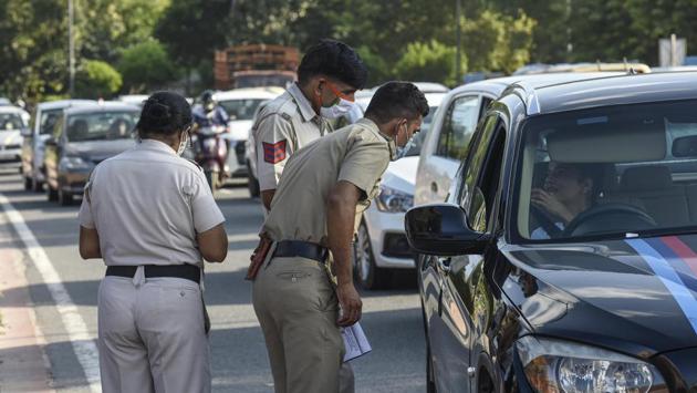 Police stop a commuter for not wearing a face mask in public, at India Gate in New Delhi on August 26. Other factors that data and circumstantial indicators suggest may be powering a spurt in cases are behavioural fatigue that could be reducing mask discipline, the reopening of the city leading to crowding, a lag in reporting leading to a possible statistical build-up, and the possibility that the rise may be part of a cyclical wave trajectory of the epidemic. (Biplov Bhuyan / HT Photo) Police stop a commuter for not wearing a face mask in public, at India Gate in New Delhi on August 26. Other factors that data and circumstantial indicators suggest may be powering a spurt in cases are behavioural fatigue that could be reducing mask discipline, the reopening of the city leading to crowding, a lag in reporting leading to a possible statistical build-up, and the possibility that the rise may be part of a cyclical wave trajectory of the epidemic. (Biplov Bhuyan / HT Photo)