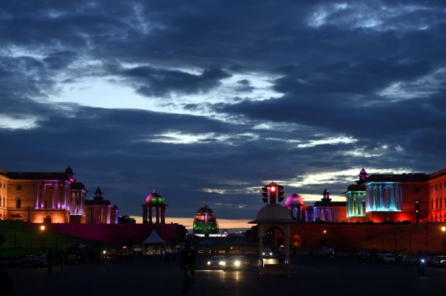 A view from Vijay Chowk of Raisina Hills and the illuminated North and South block buildings on a cloudy evening in New Delhi.(Arvind Yadav/HT PHOTO)