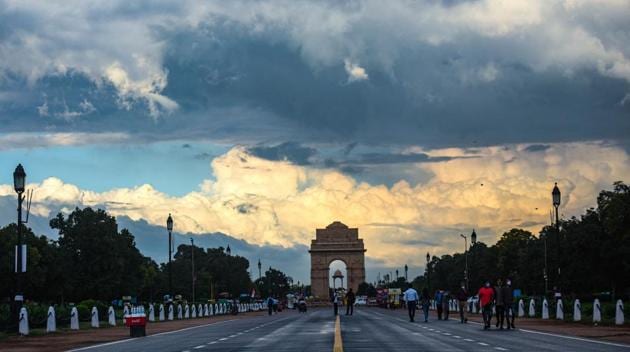 Clouds hover over India Gate in New Delhi. Data accessed by HT shows that nearly 175,000 people have been fined by Delhi Police for not wearing masks till August 23.(Amal KS/HT PHOTO)