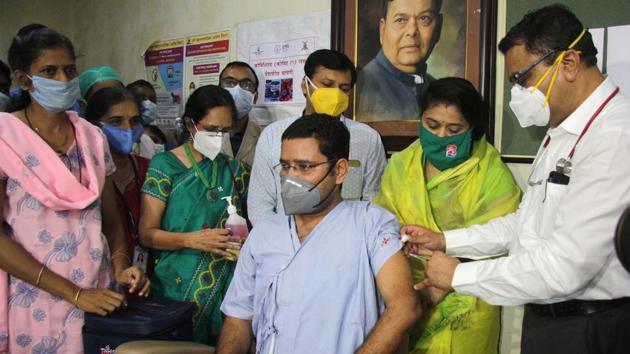 A doctor administers a Covid-19 vaccine candidate to the first volunteer at Bharati Hospital and Research Center in Pune on August 26. Laying special emphasis on tuberculosis (TB) patients, the Health Ministry’s report also said that TB is associated with a 2.1-fold increased risk of a severe Covid-19 disease, hence newly-diagnosed TB patients or those currently on treatment should be tested for Covid-19 and vice versa. (Ravindra Joshi / HT Photo) 