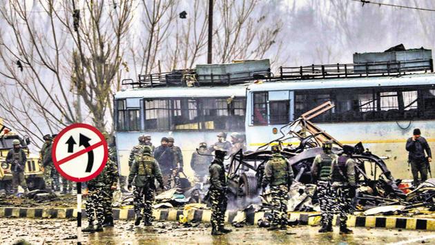 Security personnel carry out the rescue and relief works at the site of suicide bomb attack at Lathepora Awantipora in Pulwama district of south Kashmir.(PTI)