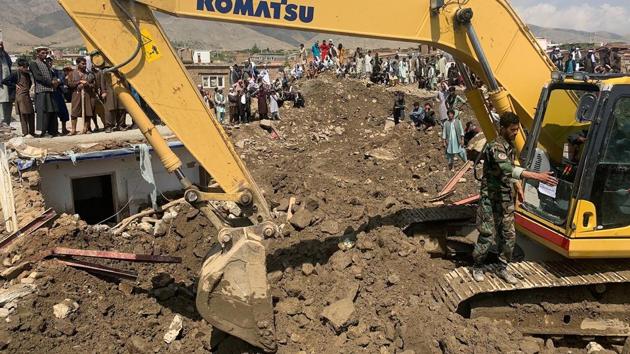 Rescuers search for victims in a mudslide in Parwan province on August 27. “The search is still on as many people, we fear, are still buried under the rocks and rubble,” Tamim Azimi, a spokesman for the ministry of disaster management was quoted by Reuters. (AP / PTI)