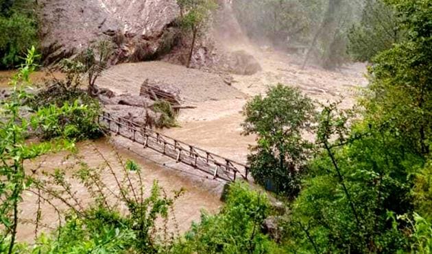 The rains also led to flashfloods in Nihargadu village of Gadsa valley in Kullu district, causing damage to a temple of a local deity.(HT Photo)