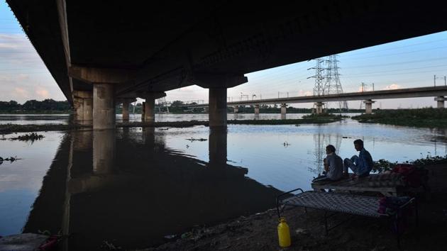 Men sit under a bridge along the swollen Yamuna river following heavy rain at Kashmere Gate in New Delhi on August 24. “Other parameters are in good shape. For instance, the death rate is low. For August, it is 1.4%, which is the best in the country. We have adequate hospital beds too. There are 14,130 total beds now, of which 10,448 beds are vacant,” the CM said. (Sanchit Khanna / HT Photo) Men sit under a bridge along the swollen Yamuna river following heavy rain at Kashmere Gate in New Delhi on August 24. “Other parameters are in good shape. For instance, the death rate is low. For August, it is 1.4%, which is the best in the country. We have adequate hospital beds too. There are 14,130 total beds now, of which 10,448 beds are vacant,” the CM said. (Sanchit Khanna / HT Photo)