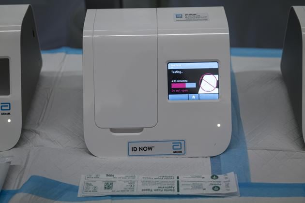 An Abbott Laboratories ID NOW rapid Covid-19 test machine runs a test at San Francisco International Airport (SFO) in San Francisco, California.(Bloomberg)