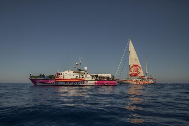 The Astral, a rescue ship from the Spanish NGO Open Arms, and the Louise Michel rescue vessel, a former French patrol boat currently manned by activists and funded by the renowned artist Banksy, meet at the Central Mediterranean sea, at 50 miles south from Lampedusa, Friday, Aug. 28, 2020. (AP) 
