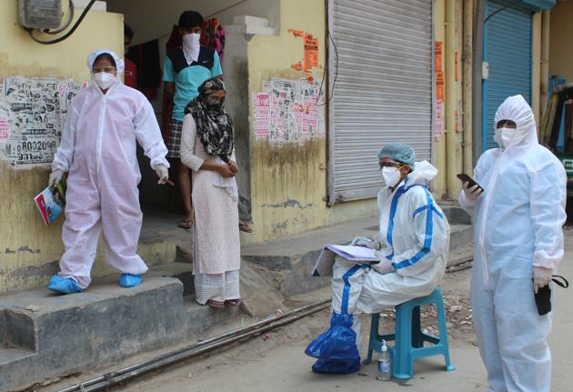 Medical workers in PPE overalls during a screening exercise in Sirhaul village during a nationwide lockdown due to coronavirus pandemic, at Sirhaul village.(Yogendra Kumar/HT PHOTO)