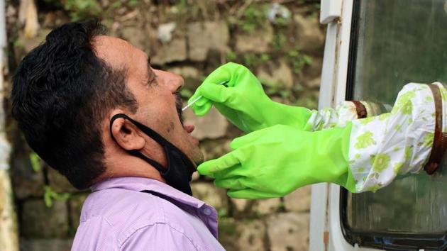 A man giving his sample for Covid-19 testing in Himachal Pradesh.(HT File)