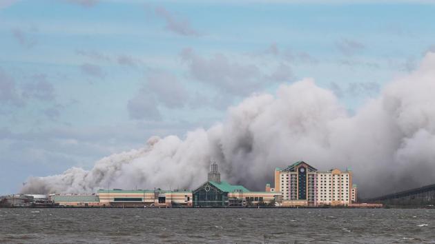 A massive plume of smoke billows from what is reported to be a chemical plant fire after Hurricane Laura passed through the area in Lake Charles. The flames continued to send a chlorine-infused plume of smoke skyward nearly 24 hours after landfall. Nearby residents were told to close their doors and windows and turn off air conditioners. (Joe Raedle / Getty Images / AFP) A massive plume of smoke billows from what is reported to be a chemical plant fire after Hurricane Laura passed through the area in Lake Charles. The flames continued to send a chlorine-infused plume of smoke skyward nearly 24 hours after landfall. Nearby residents were told to close their doors and windows and turn off air conditioners. (Joe Raedle / Getty Images / AFP)