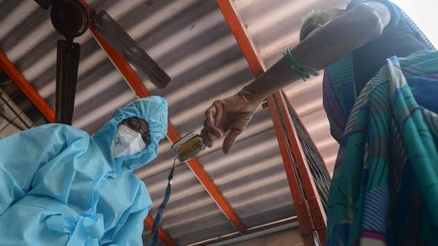 A health worker wearing PPE coveralls uses a fingertip pulse oximeter on a resident during a Covid-19 door-to-door screening in Mumbai on August 27. The Union Health Ministry said that the early focus on surveillance and contact tracing through house-to-house survey was continuously strengthened with an increase in testing for ensuring early identification of positive cases, HT reported. (Indranil Mukherjee / AFP) A health worker wearing PPE coveralls uses a fingertip pulse oximeter on a resident during a Covid-19 door-to-door screening in Mumbai on August 27. The Union Health Ministry said that the early focus on surveillance and contact tracing through house-to-house survey was continuously strengthened with an increase in testing for ensuring early identification of positive cases, HT reported. (Indranil Mukherjee / AFP)
