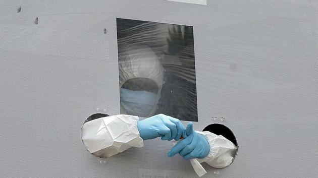 A health worker wearing PPE coveralls seen inside a coronavirus testing van in Hyderabad on August 25. According to the Indian Council of Medical Research (ICMR), on August 28, 9,28,761 samples were tested while overall over 4.04 crore samples have been tested until now. (Noah Seelam / AFP) A health worker wearing PPE coveralls seen inside a coronavirus testing van in Hyderabad on August 25. According to the Indian Council of Medical Research (ICMR), on August 28, 9,28,761 samples were tested while overall over 4.04 crore samples have been tested until now. (Noah Seelam / AFP)