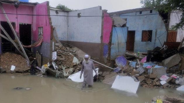 A man examines his house damaged by heavy rains in Yar Mohammad village near Karachi on August 27. Chief Minister Murad Ali Shah told Reuters that heavy rainfall has caused a “disastrous situation” as the rains are expected to continue through the week in Karachi. (Fareen Khan / AP) A man examines his house damaged by heavy rains in Yar Mohammad village near Karachi on August 27. Chief Minister Murad Ali Shah told Reuters that heavy rainfall has caused a “disastrous situation” as the rains are expected to continue through the week in Karachi. (Fareen Khan / AP)