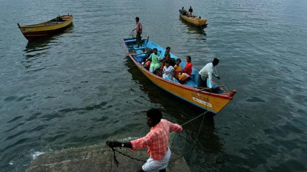 Fishermen and women return to their homes in Port Blair, in India's Andaman and Nicobar Islands archipelago, Thursday, Sept. 6, 2007.(AP Photo/Aijaz Rahi, File)
