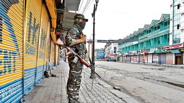 A security personnel stands guard in Srinagar.(AFP)