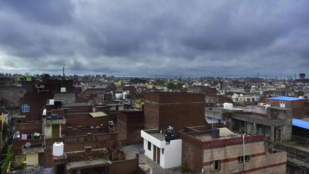 Monsoon clouds hover over a residential area in Amritsar on August 28. According to IMD data, there has been an overall excess rain of 25% in August across India, a level not seen since 1976 when the country received 28.4% more rain than is usual for this time of the year. (Sameer Sehgal / HT Photo)