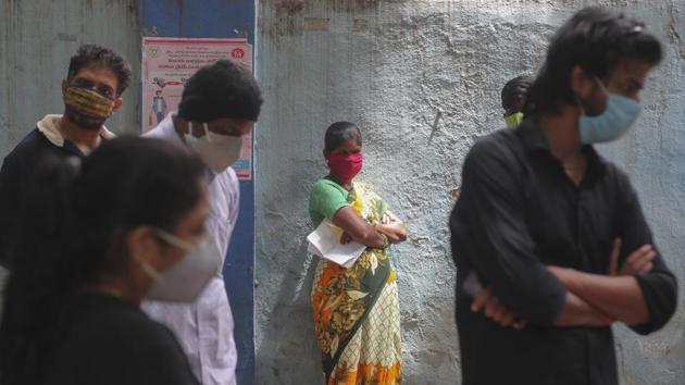 People wait to give their nasal swab samples to test for Covid-19 in Hyderabad. (AP) People wait to give their nasal swab samples to test for Covid-19 in Hyderabad. (AP)