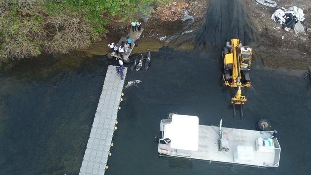 Coastguards bring dead dolphins to the marine fish farm of Mahebourg, Mauritius on August 28. So far veterinarians have examined only two of the dolphins, which bore signs of injury but no trace of hydrocarbons in their bodies, according to preliminary autopsy results. The autopsy on the first two was conducted by the government-run Albion Fisheries Research Centre. (Reuben Pillay / REUTERS) Coastguards bring dead dolphins to the marine fish farm of Mahebourg, Mauritius on August 28. So far veterinarians have examined only two of the dolphins, which bore signs of injury but no trace of hydrocarbons in their bodies, according to preliminary autopsy results. The autopsy on the first two was conducted by the government-run Albion Fisheries Research Centre. (Reuben Pillay / REUTERS)