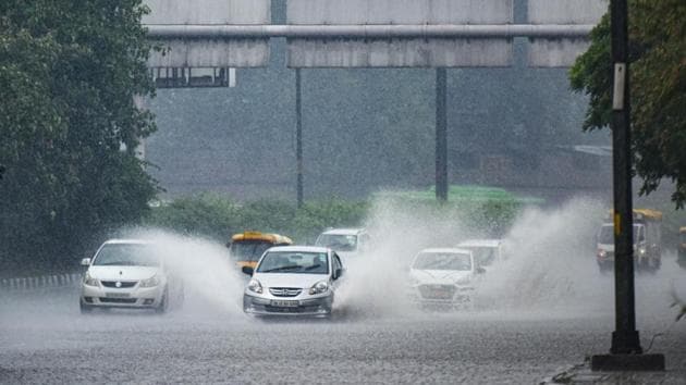 Vehicular traffic moves along a waterlogged stretch in New Delhi on August 28. The largest excess rain recorded in the month of August till now has been in 1926 at 33%. Overall monsoon rain this year is 8% excess so far, with 23% excess over south peninsula; 16% excess over central India; 12% deficient over north-west India, and 4% excess over east and north-east India. The monsoon runs from beginning of June to September end. (Amal KS / HT Photo)