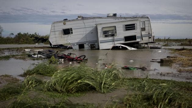 A damaged travel trailer sits among flood water after Hurricane Laura passed through the area August 27, 2020 in Holly Beach, Louisiana.(AFP)