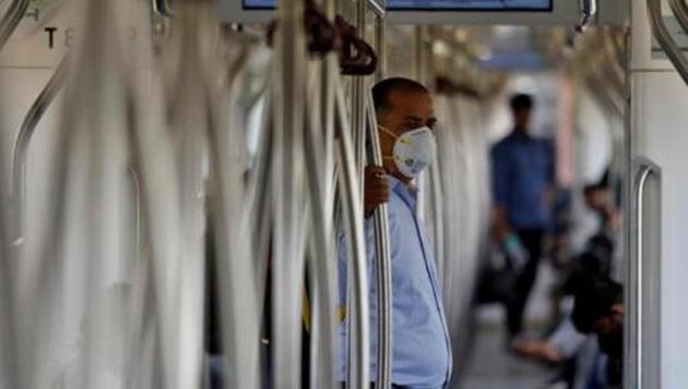 A commuter wearing a mask travels in a metro amid coronavirus fears, in New Delhi, India.(Reuters photo) A commuter wearing a mask travels in a metro amid coronavirus fears, in New Delhi, India.(Reuters photo)