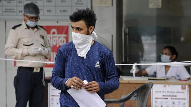 A man wearing a face mask walks out from the Government District Hospital in Sector 30, Noida on August 29. With more patients recovering and being discharged from home isolation (in case of mild and moderate cases) and hospitals (severe and critical cases), India’s number of Covid-19 recoveries is now over 26 lakh. (Sunil Ghosh / HT Photo) A man wearing a face mask walks out from the Government District Hospital in Sector 30, Noida on August 29. With more patients recovering and being discharged from home isolation (in case of mild and moderate cases) and hospitals (severe and critical cases), India’s number of Covid-19 recoveries is now over 26 lakh. (Sunil Ghosh / HT Photo)