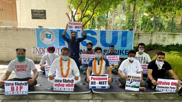 National Chairman of NSUI Social Media, Manoj Lubana and Vice-president of PUCSC 2019-2020, Rahul Kumar sit on hunger strike during a protest to postpone JEE-NEET exam, in front of the Congress Bhawan in Chandigarh on Saturday.(ANI) National Chairman of NSUI Social Media, Manoj Lubana and Vice-president of PUCSC 2019-2020, Rahul Kumar sit on hunger strike during a protest to postpone JEE-NEET exam, in front of the Congress Bhawan in Chandigarh on Saturday.(ANI)