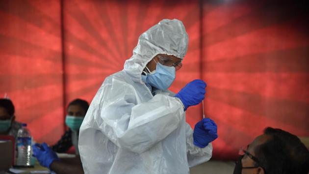 A health worker collects a swab sample from a man to test for Covid-19 infection at Lubrizol Staff CHS in Sector-16, Navi Mumbai on August 26. India’s coronavirus disease (Covid-19) testing has crossed the 40 million mark with just over a million tests done on August 29 alone, the Indian Council of Medical Research (ICMR) dashboard shows. (Bachchan Kumar / HT Photo) A health worker collects a swab sample from a man to test for Covid-19 infection at Lubrizol Staff CHS in Sector-16, Navi Mumbai on August 26. India’s coronavirus disease (Covid-19) testing has crossed the 40 million mark with just over a million tests done on August 29 alone, the Indian Council of Medical Research (ICMR) dashboard shows. (Bachchan Kumar / HT Photo)