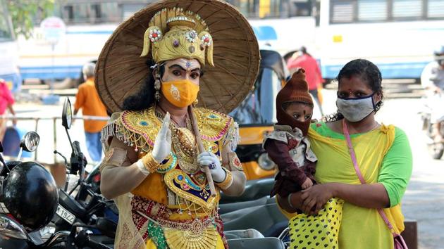 A man dressed up as King Mahabali greeting people on the occasion of Onam. A scene from the state capital Thiruvananthapuram on Sunday.(VIVEK R NAIR/HT PHOTO.)