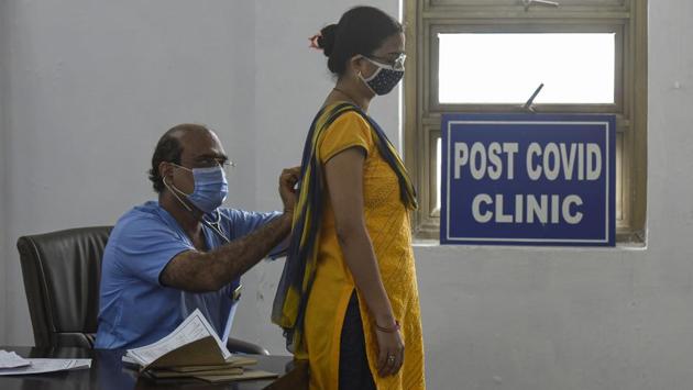 A doctor examines a woman who recovered from Covid-19 at Rajiv Gandhi Super Speciality Hospital in New Delhi on Sunday August 30. A significant feature of India’s management of Covid-19 cases is the growing rate of recovered patients. A higher number of patients are recovering and being discharged from hospitals and home isolation, the ministry highlighted. (Biplov Bhuyan / HT Photo)