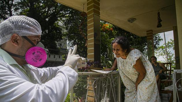 A health worker shows the result of a nasal swab test for COVID-19 during a door to door test drive in Guwhati on August 29. To effectively control the spread of Covid-19, the government has focused on ramping up the testing capacity to over one million a day. India has breached the mark thrice – on August 21 with 1.02 million tests, on August 30 with 1.05 million tests and August 31 with 1.01 million tests. (Anupam Nath / AP) A health worker shows the result of a nasal swab test for COVID-19 during a door to door test drive in Guwhati on August 29. To effectively control the spread of Covid-19, the government has focused on ramping up the testing capacity to over one million a day. India has breached the mark thrice – on August 21 with 1.02 million tests, on August 30 with 1.05 million tests and August 31 with 1.01 million tests. (Anupam Nath / AP)