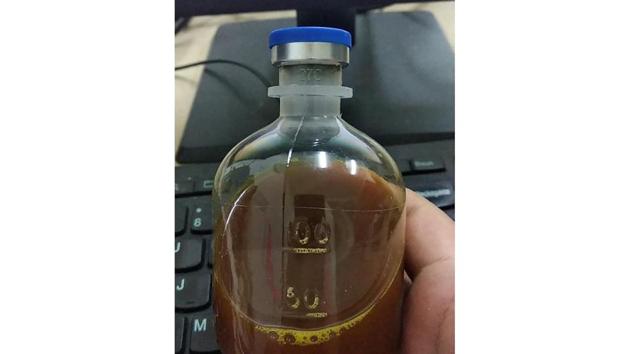 This August 2020, photo provided by a Uighur under quarantine shows a bottle of unidentified traditional Chinese medicine in Urumqi, China. As parts of the Xinjiang region in China's far northwest enters the 45th day of a second grueling lockdown due to a coronavirus outbreak, the government there is coercing some residents into using traditional Chinese medicine despite a lack of rigorous clinical data proving it works.(AP)