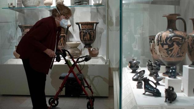 A visitor looks closely at artifacts inside the Metropolitan Museum of Art in New York on August 29. Also paying close attention to events in the country amid the lockdown, the Met has added one new exhibit dedicated to African American artist Jacob Lawrence (1917-2000) in a bid to make the “more inclusive” amid the rise of movements on social inequality, Met President Daniel Weiss told AFP. (Kena Betancur / AFP) A visitor looks closely at artifacts inside the Metropolitan Museum of Art in New York on August 29. Also paying close attention to events in the country amid the lockdown, the Met has added one new exhibit dedicated to African American artist Jacob Lawrence (1917-2000) in a bid to make the “more inclusive” amid the rise of movements on social inequality, Met President Daniel Weiss told AFP. (Kena Betancur / AFP)