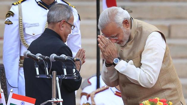 Newly appointed Prime Minister Narendra Modi greets President Pranab Mukherjee at the former’s swearing in ceremony at Rashrapati Bhawan in New Delhi on May 26, 2014. Among some of Mukherjee’s crucial decisions were setting up regional rural banks (1975) and the EXIM Bank of India as well as National Bank for Agriculture and Rural Development (1981-82). (Ajay Aggarwal / HT Archive) 